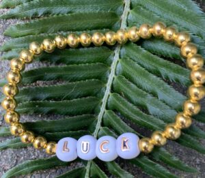 gold ball positive bracelet